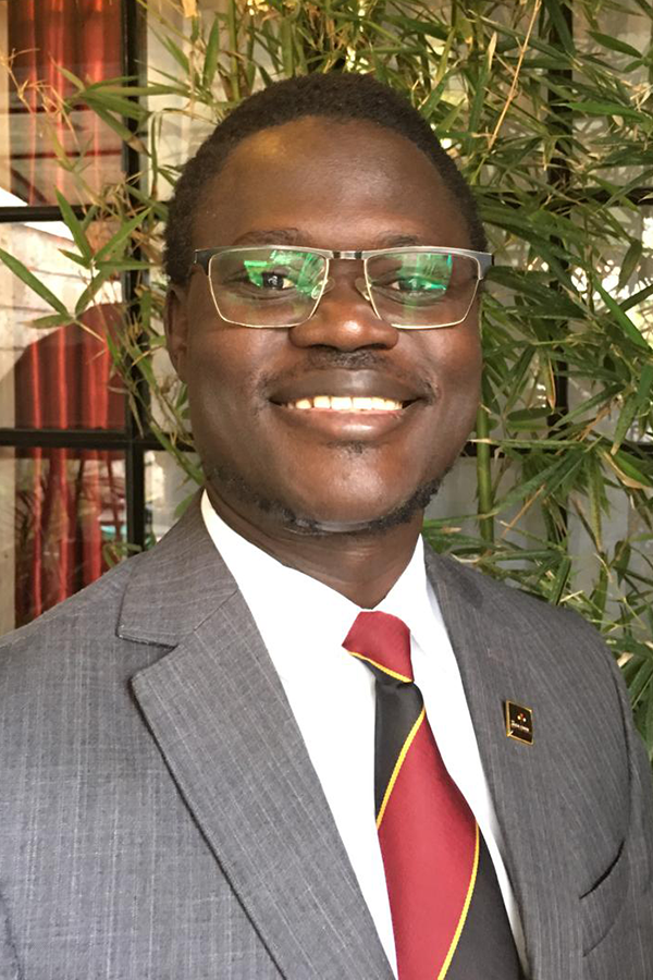 Dr. Andrew J. Okello